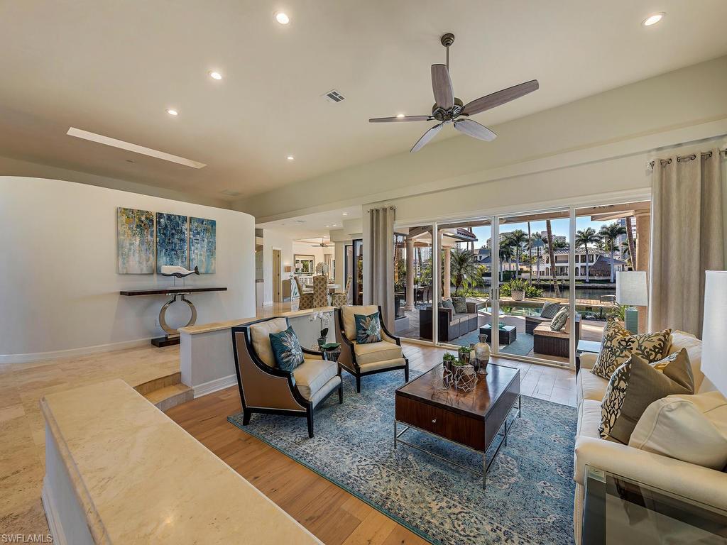 4217 Crayton Road Naples, FL 34103 - Photo 4 of 22 a living room with furniture and a large window