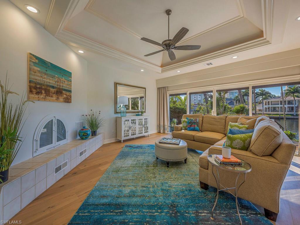4217 Crayton Road Naples, FL 34103 - Photo 5 of 22 a living room with furniture and a large window