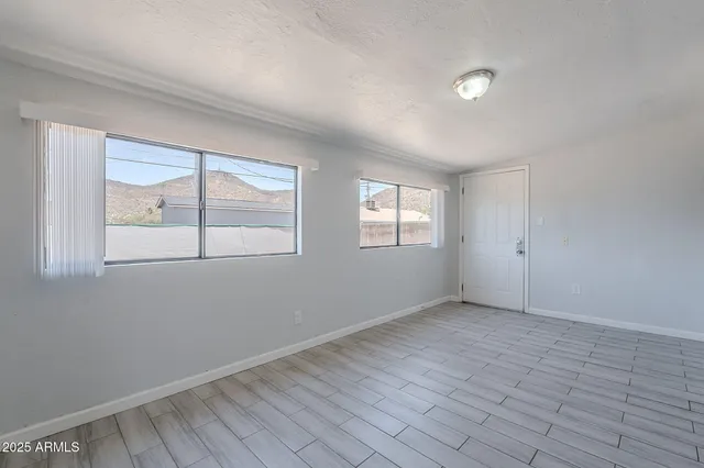 an empty room with windows