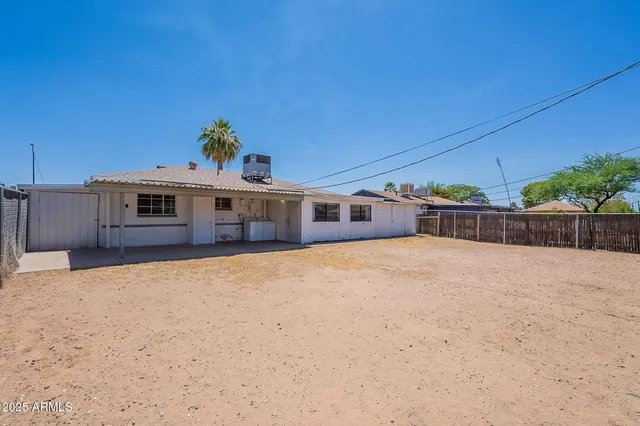 a front view of a house with a large window
