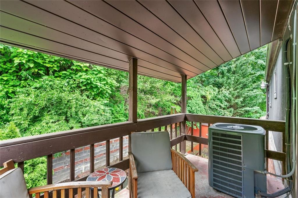 121 Frazier Avenue McKees Rocks, PA 15136 - Photo 20 of 29 a view of a roof deck with wooden fence and floor