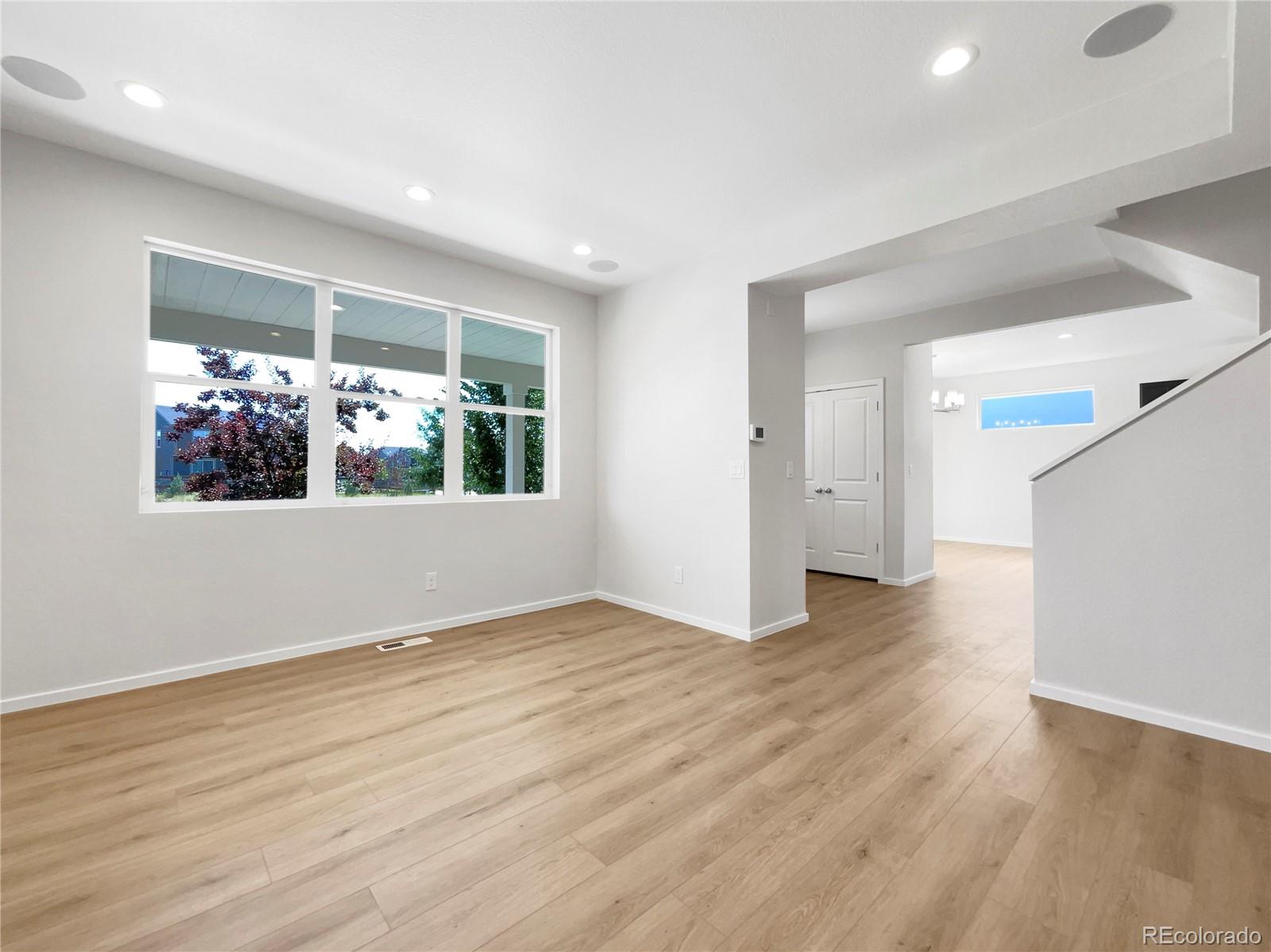 12825 Eagle River Road Firestone, CO 80504 - Photo 17 of 32 a view of a room with wooden floor