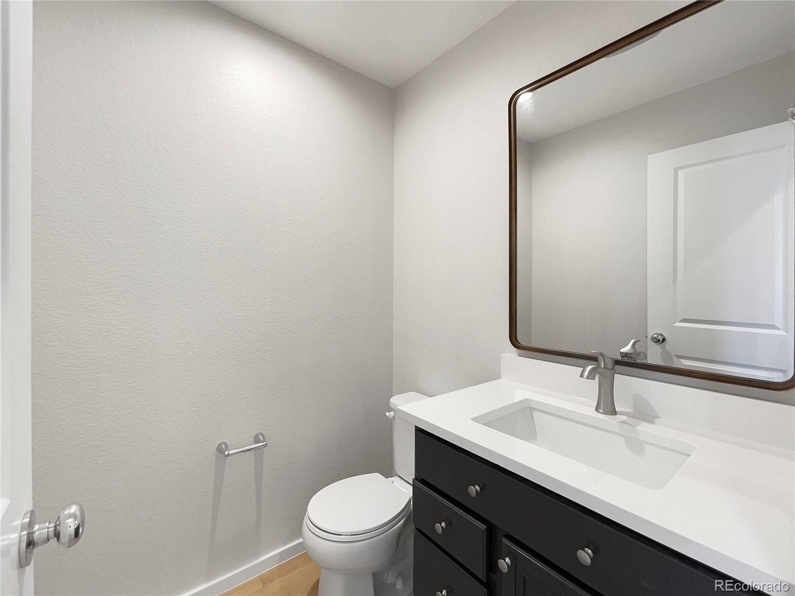 12825 Eagle River Road Firestone, CO 80504 - Photo 19 of 32 a bathroom with a sink and a toilet