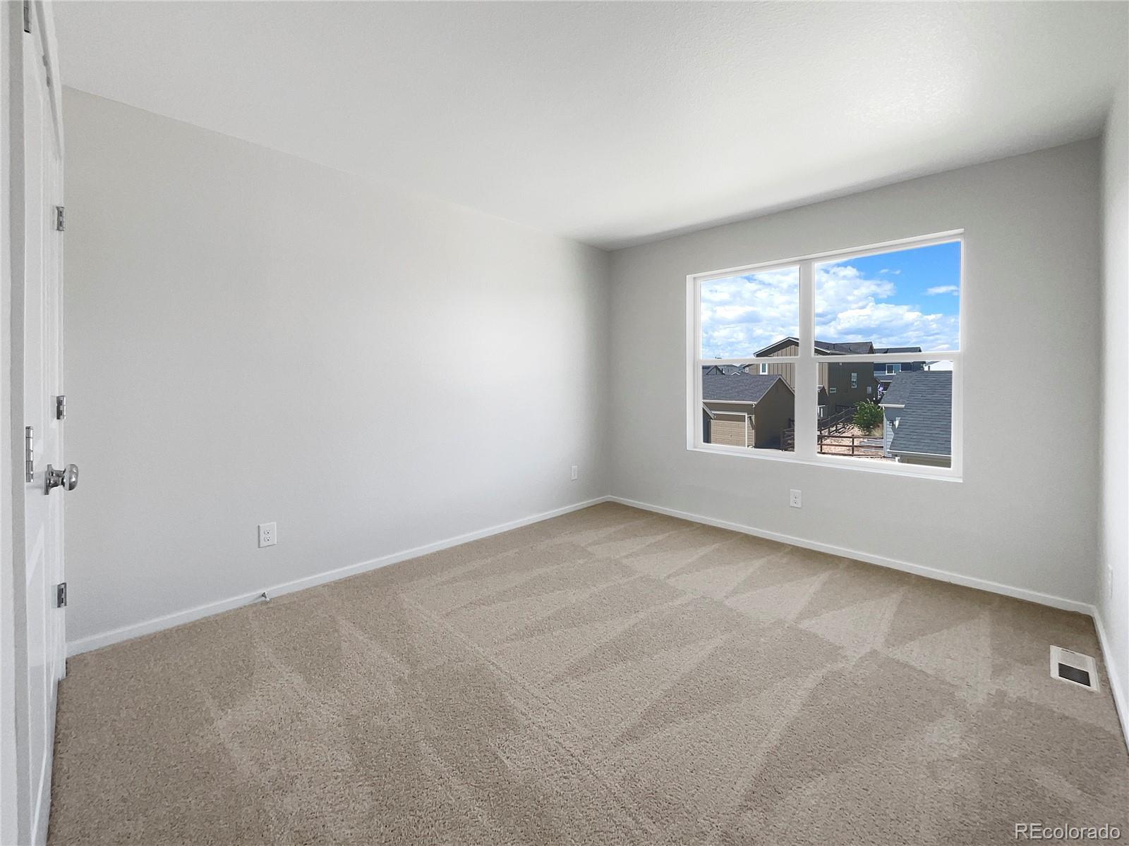 12825 Eagle River Road Firestone, CO 80504 - Photo 26 of 32 a view of an empty room with a window