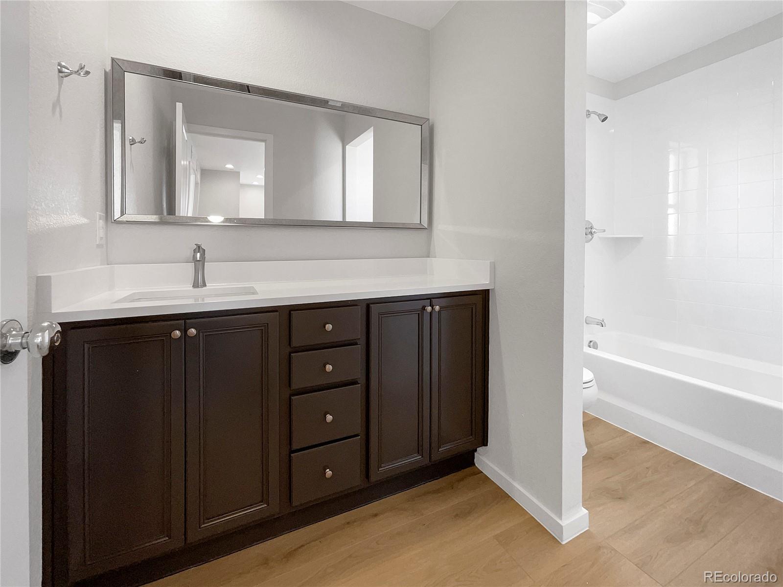 12825 Eagle River Road Firestone, CO 80504 - Photo 27 of 32 a bathroom with a sink and a mirror