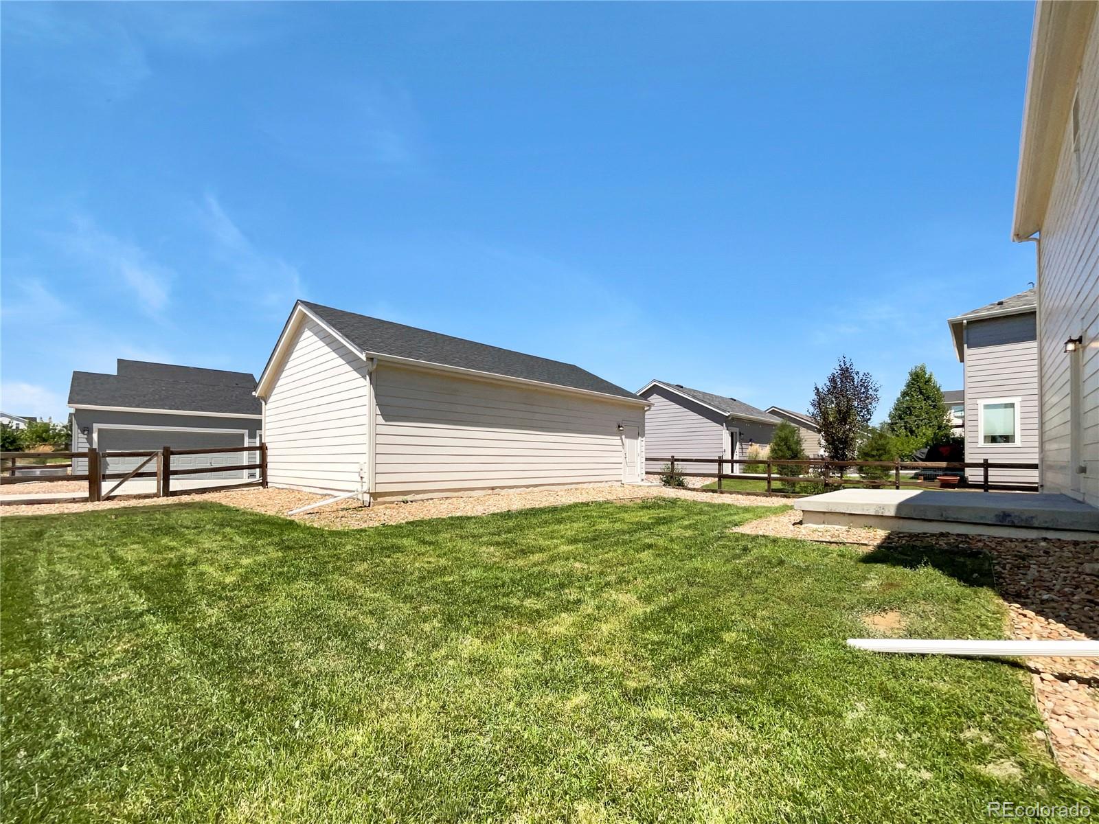 12825 Eagle River Road Firestone, CO 80504 - Photo 30 of 32 a house view with a garden space