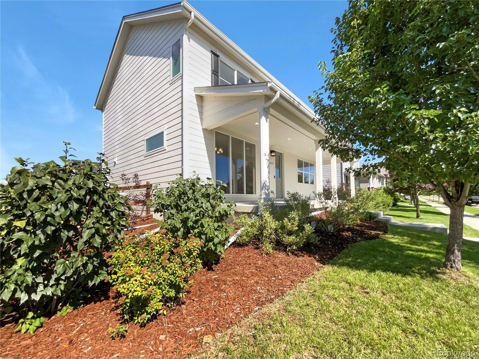 12825 Eagle River Road Firestone, CO 80504 - Photo 7 of 32 a view of a house with a yard