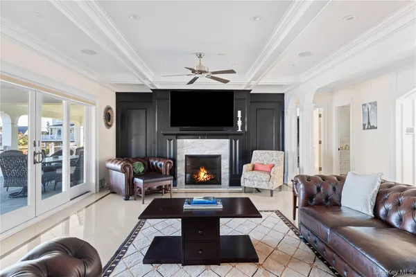 a living room with furniture rug and window