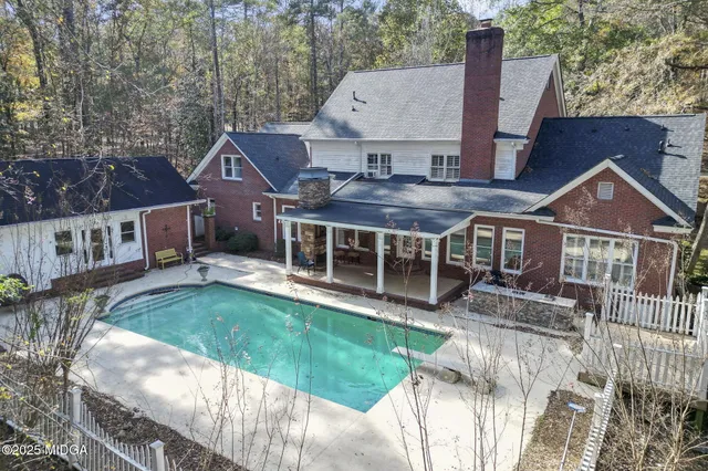 a kitchen with stainless steel appliances granite countertop a sink and a refrigerator