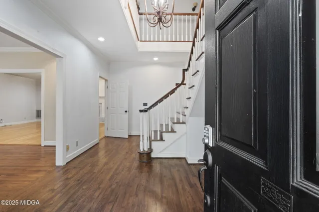 a view of a hallway with stairs