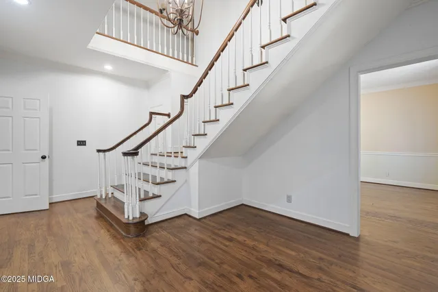 a bathroom with a granite countertop double vanity sink mirror and double