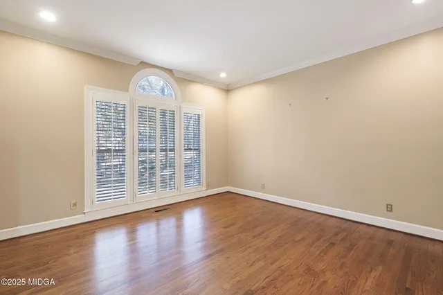 a room with a dresser and a window
