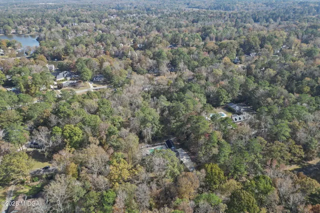 a view of entryway with wooden floor and stairs