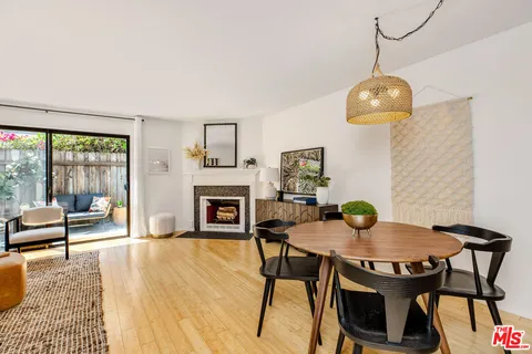 a view of a dining room with furniture wooden floor and chandelier