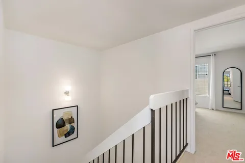 a view of a hallway with windows