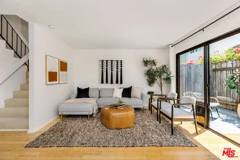 a living room with furniture and a rug