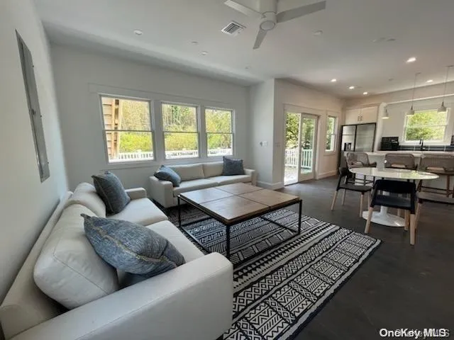 a living room with furniture and a rug