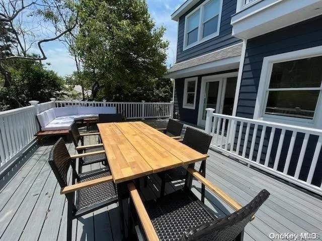 a view of a patio with wooden floor