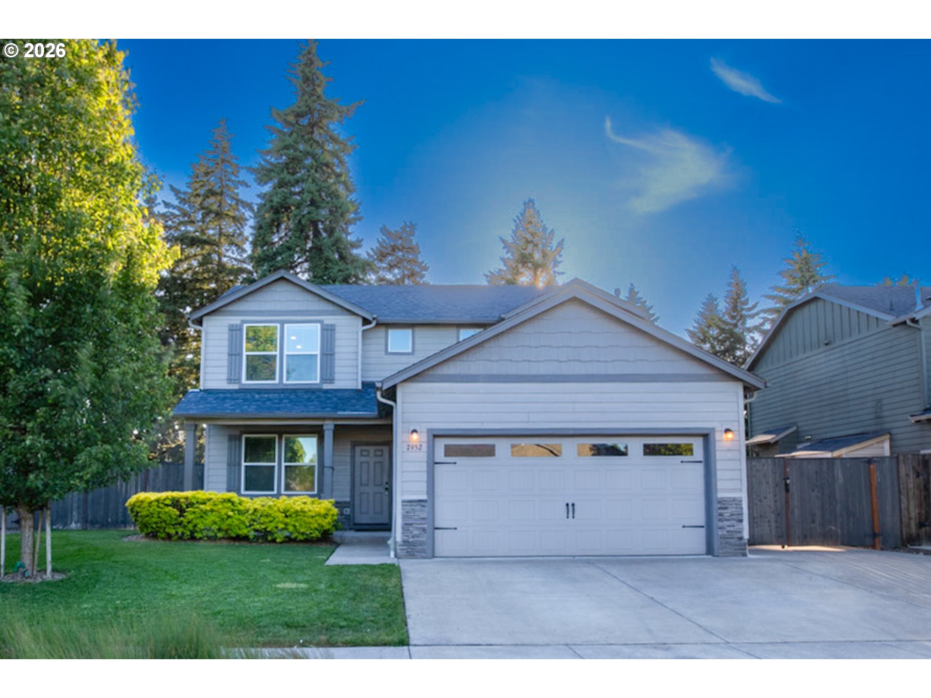 2952 Shelby Way Eugene, OR 97404 - Photo 2 of 25 a front view of a house with a yard and garage