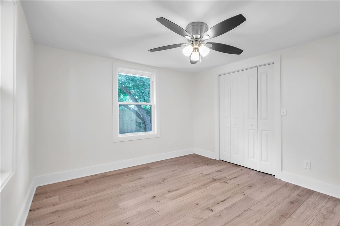 7 Beaverdam Road Williamston, SC 29697 - Photo 13 of 27 A well-lit room with LVP flooring provides a comfortable living space.