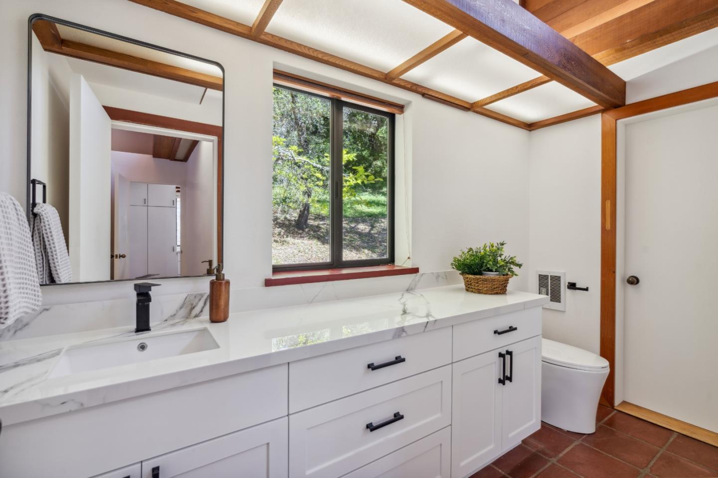 620 Twin Lane Soquel, CA 95073 - Photo 17 of 67 a bathroom with a sink and mirror with window