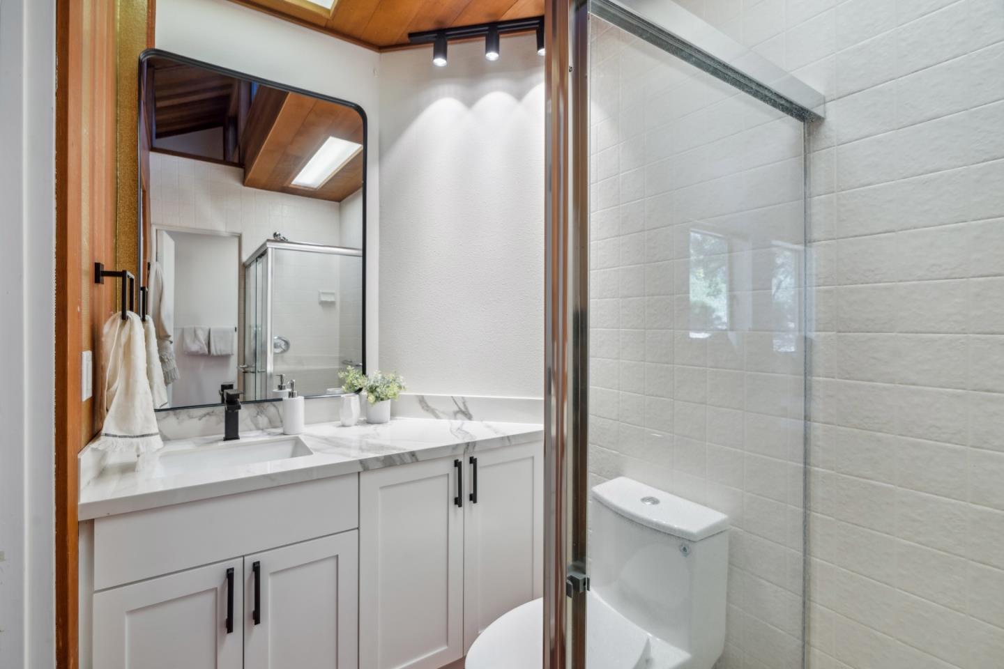620 Twin Lane Soquel, CA 95073 - Photo 20 of 67 a bathroom with a sink a toilet and shower