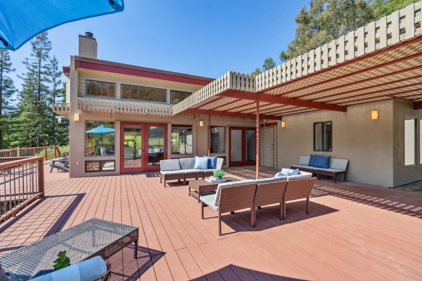 620 Twin Lane Soquel, CA 95073 - Photo 28 of 67 a view of a patio with couches table and chairs and potted plants