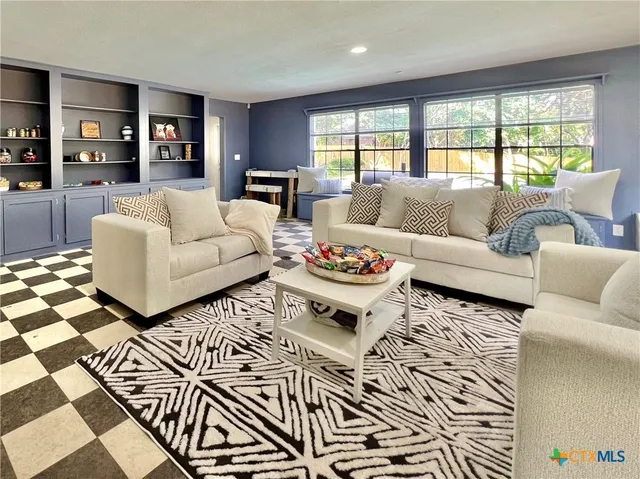 a view of a dining room with furniture wooden floor and chandelier