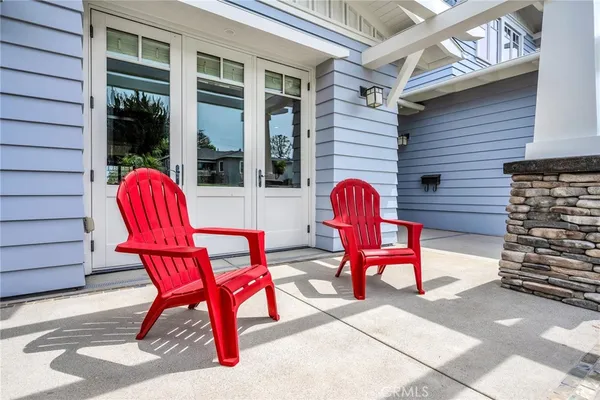 a outdoor space with lots of chairs and a barbeque