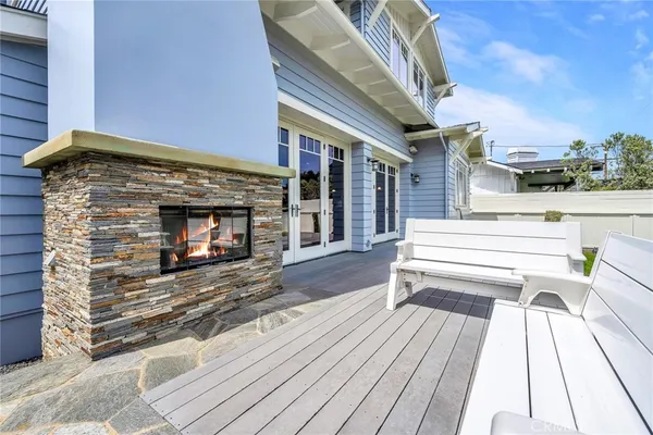 a view of a terrace with a couch and wooden floor