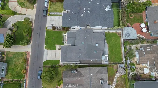 an aerial view of a house with a swimming pool
