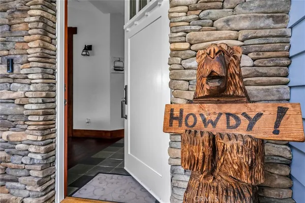 a view of a door and a street sign