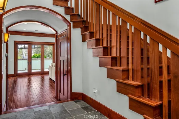 a view of an entryway with wooden floor