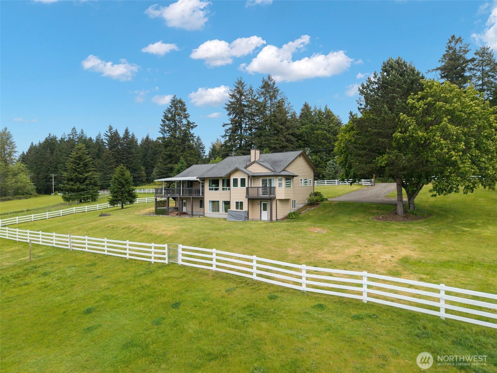 14110 Glenwood Road Southwest Port Orchard, WA 98367 - Photo 38 of 40 a view of a house with a swimming pool
