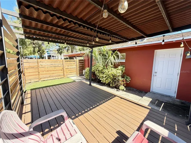 a view of outdoor space with wooden floor