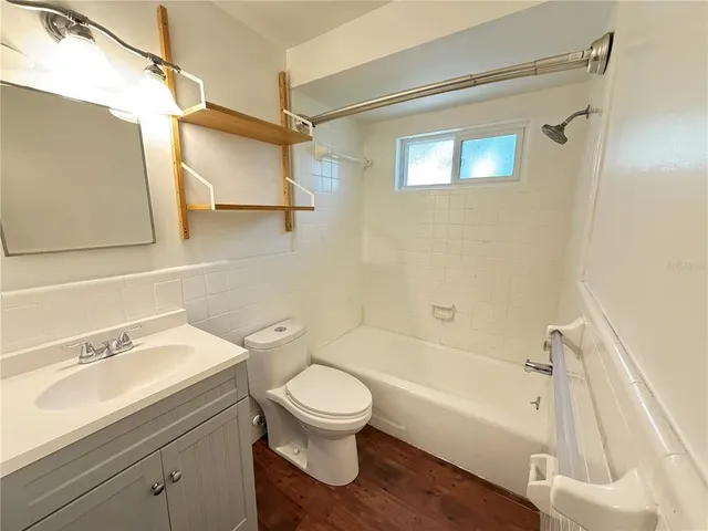 a bathroom with a toilet and a bathtub