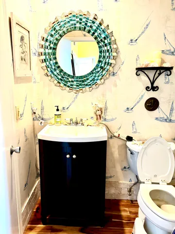 a bathroom with a sink and mirror