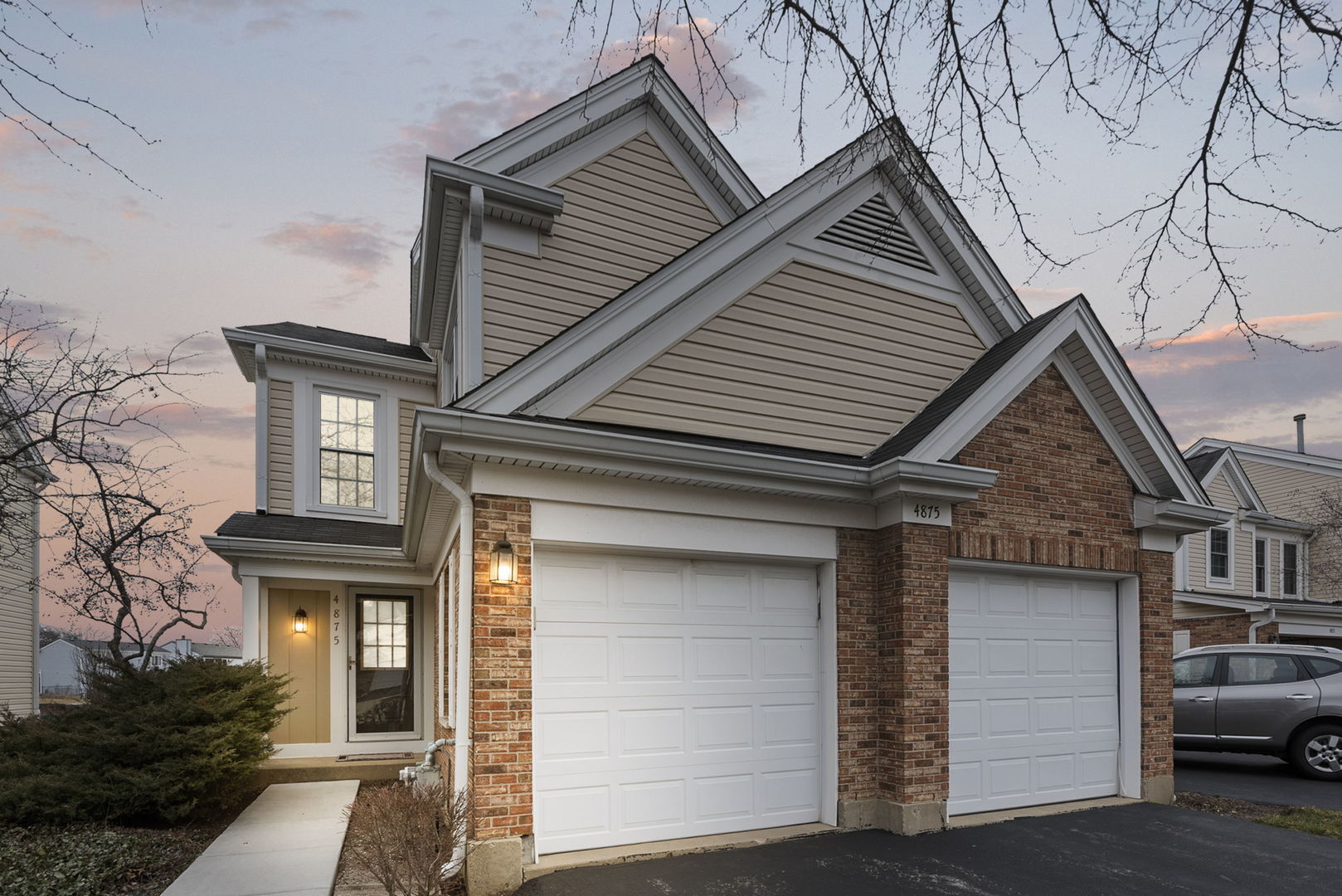 4875 Turnberry Drive Hoffman Estates, IL 60010 - Photo 1 of 22 a front view of a house with garage