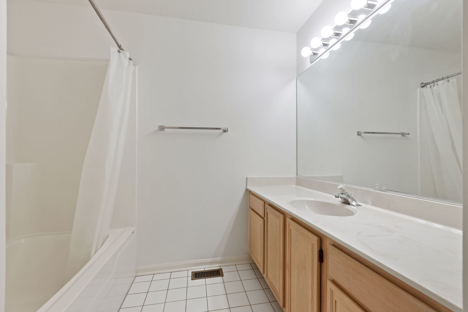 4875 Turnberry Drive Hoffman Estates, IL 60010 - Photo 13 of 22 a bathroom with a sink a vanity and a mirror