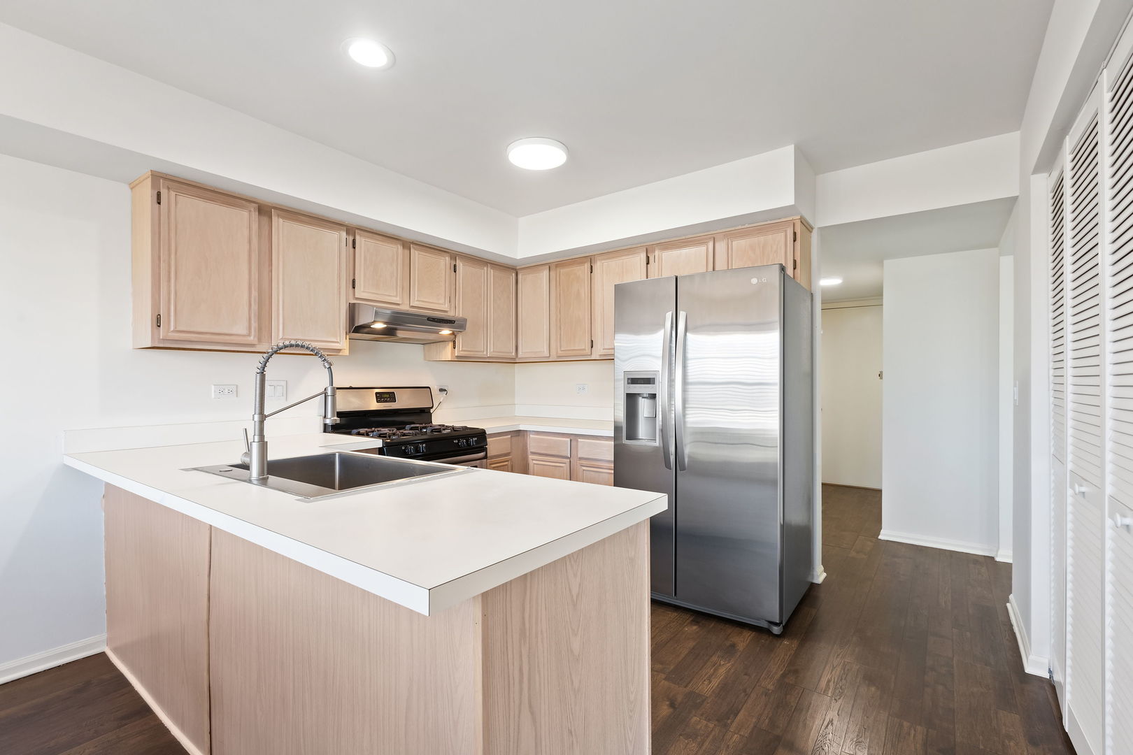 4875 Turnberry Drive Hoffman Estates, IL 60010 - Photo 8 of 22 a kitchen with a refrigerator sink and cabinets