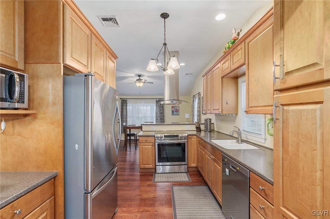 62 School Lane Reading, PA 19606 - Photo 15 of 33 a large kitchen with stainless steel appliances granite countertop a sink and cabinets