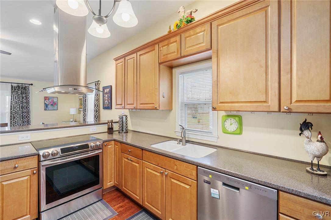 62 School Lane Reading, PA 19606 - Photo 16 of 33 a kitchen with stainless steel appliances a sink a stove and cabinets