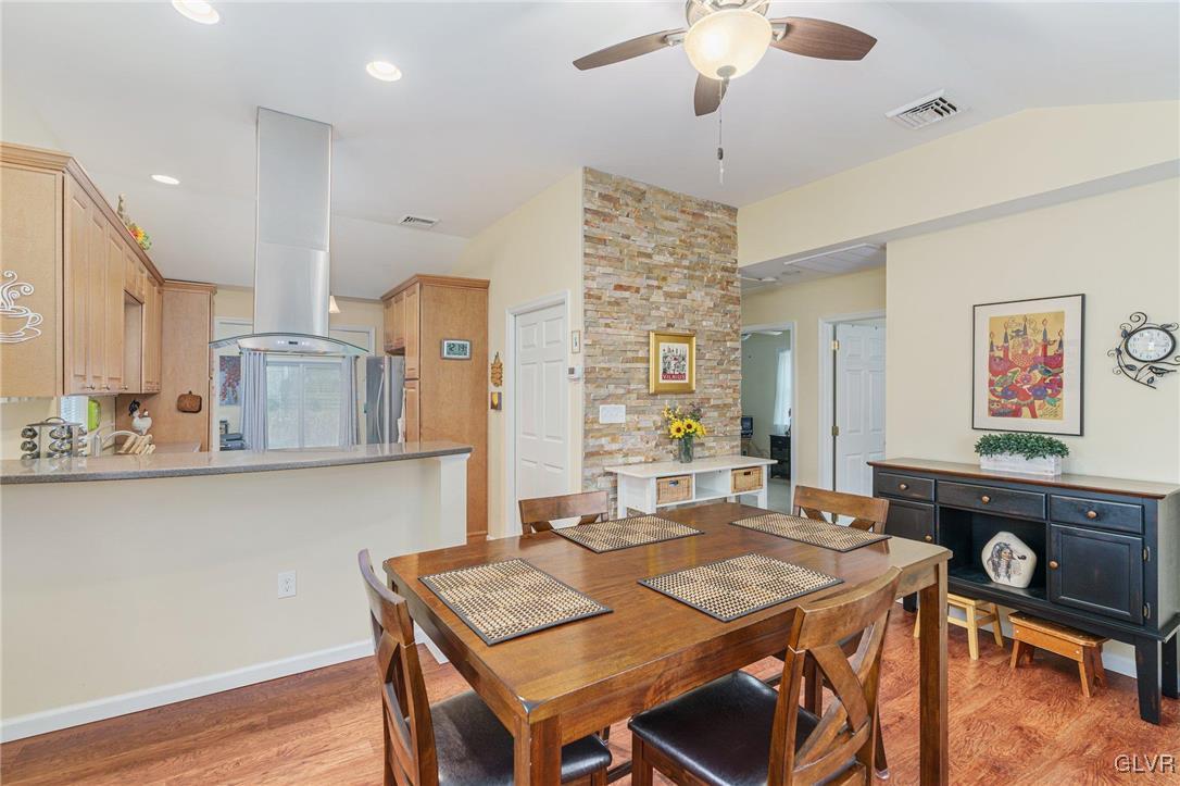62 School Lane Reading, PA 19606 - Photo 22 of 33 a view of a dining room with furniture and wooden floor