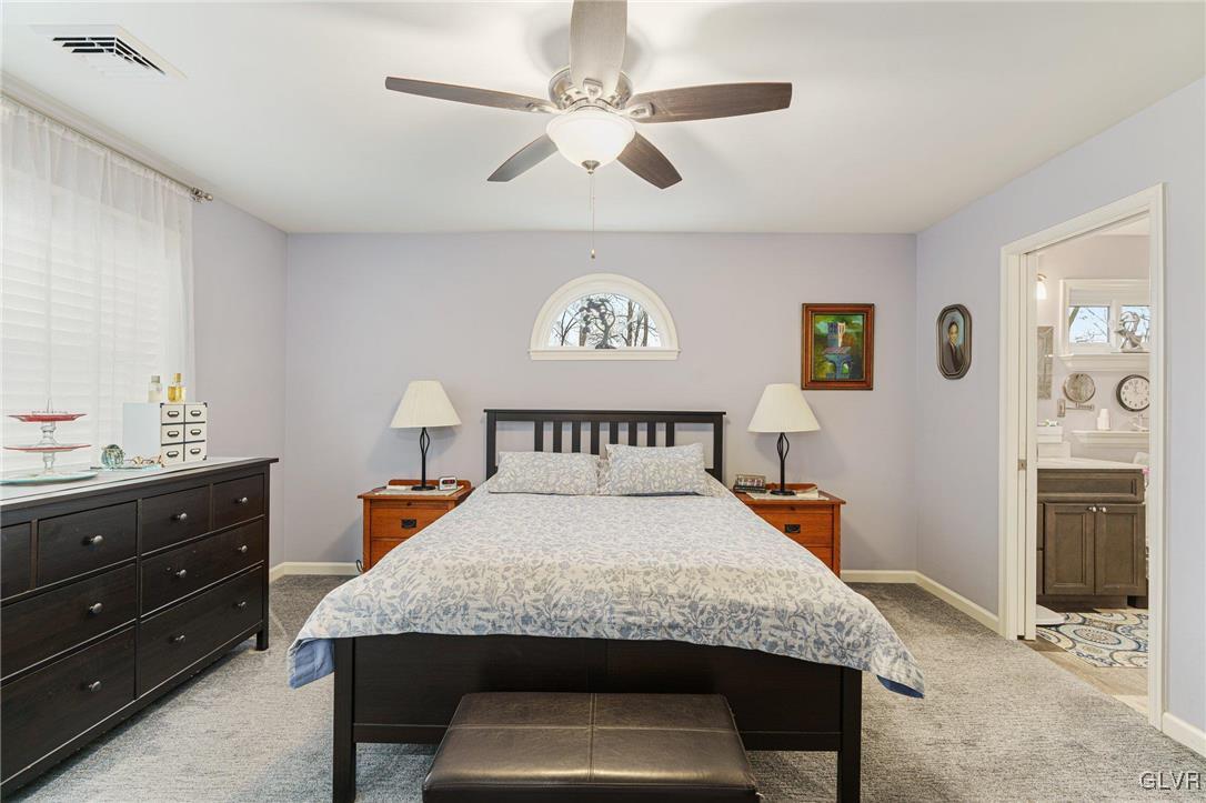 62 School Lane Reading, PA 19606 - Photo 25 of 33 a bedroom with a large bed and a chandelier
