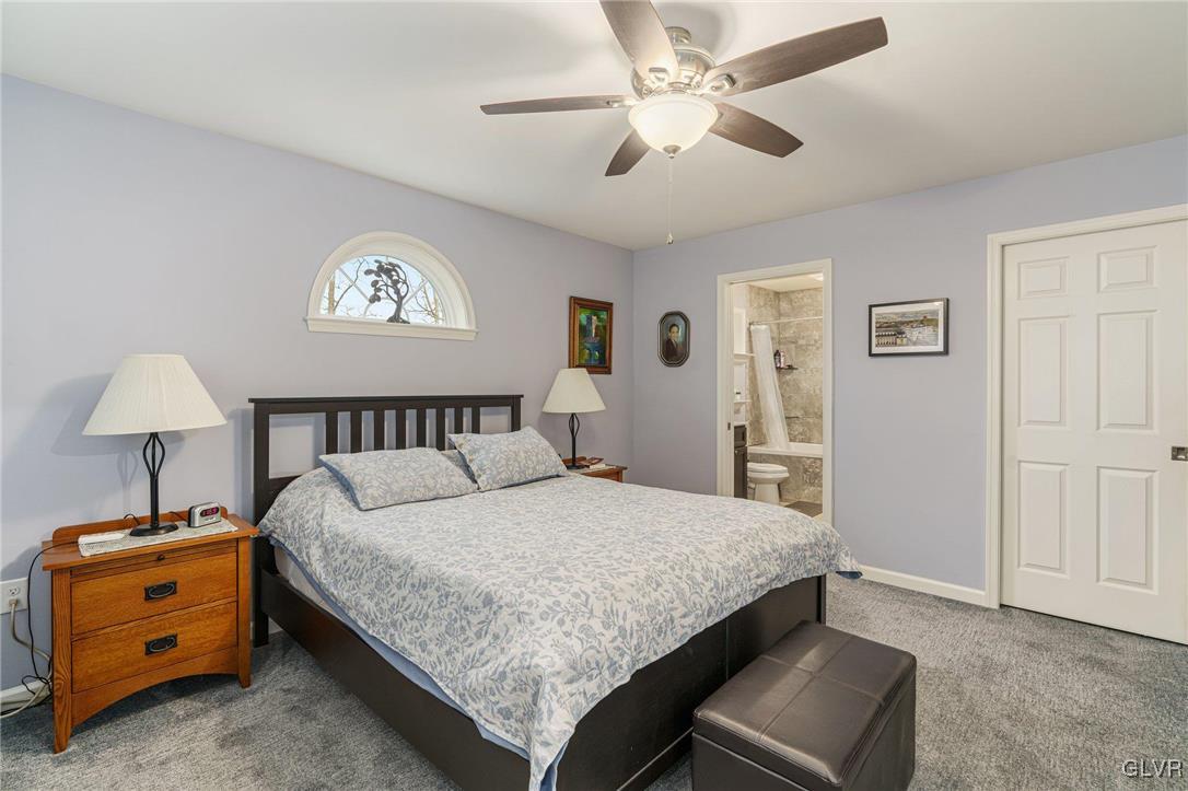 62 School Lane Reading, PA 19606 - Photo 26 of 33 a bedroom with a bed and a chandelier
