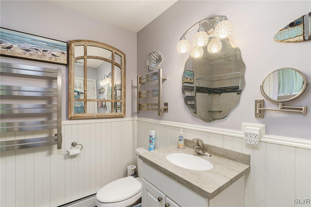 62 School Lane Reading, PA 19606 - Photo 30 of 33 a bathroom with a sink a toilet and a mirror