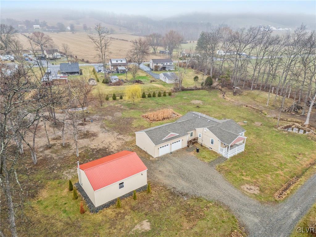 62 School Lane Reading, PA 19606 - Photo 3 of 33 an aerial view of a house with a yard and lake view in back