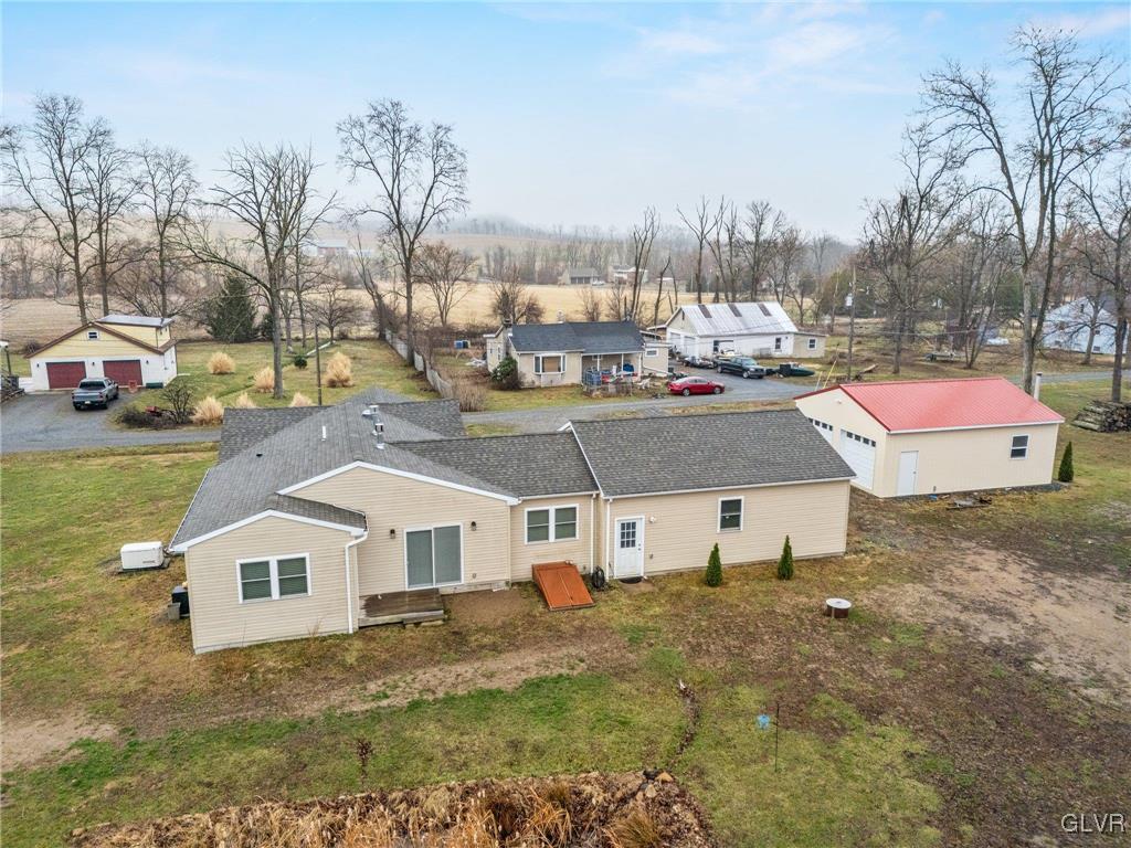 62 School Lane Reading, PA 19606 - Photo 6 of 33 a aerial view of a house with a big yard and large trees