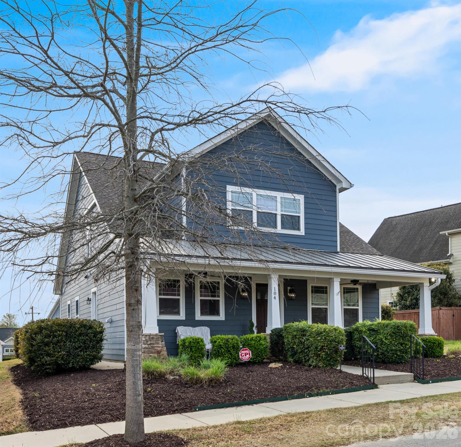 104 Meyers Ridge Road Cramerton, NC 28032 - Photo 3 of 36 a front view of a house with a garden
