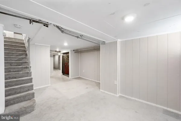 a view of an empty room with stairs